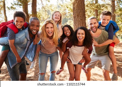 Portrait Of Family With Friends On Hiking Adventure In Forest - Shutterstock ID 1102115744