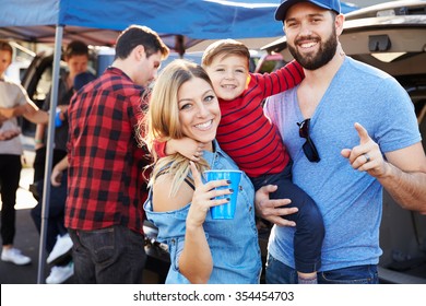 Portrait Of Family Group Tailgating In Stadium Car Park