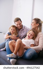 Portrait Of Family Having Fun In The Living Room.