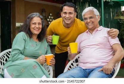 portrait of family having fun together in garden
