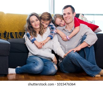 Portrait Family Members Spending Quality Time Together At Home