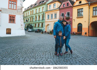 Portrait Of Family In Old Street Of Romanian City