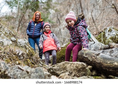 Portrait Of Family On Hiking Forest Trip With Hiking Clothes. Winter Portrait Of Family On Family Hike In Forest, Active Family, Parents And Children Mountaineering In The Nature.