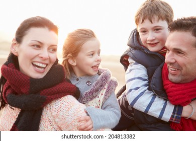 Portrait Of Family On Winter Beach