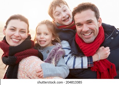 Portrait Of Family On Winter Beach