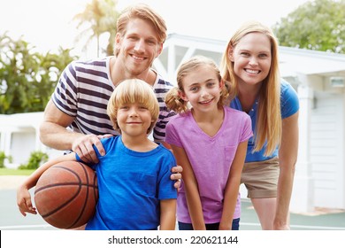 Portrait Of Family Playing Basketball Together