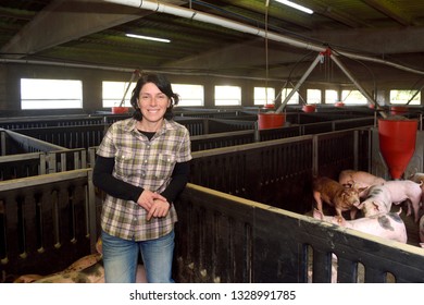 portrait of a farm woman on a pig farm