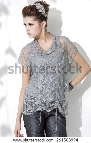 portrait of fashion girl posing in light background