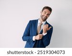 Portrait, fashion and happy man in suit for wedding event, marriage ceremony or laugh in studio. Face, smile or groom in stylish formal clothes to prepare for party on white background space in Spain