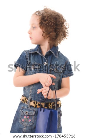 portrait of the fashion shopping little girl with shopping bags, isolated over white