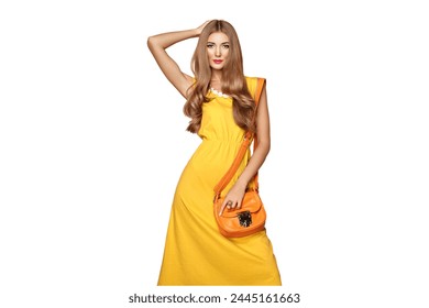 Portrait of Fashion Young woman in Yellow Dress. Female Model in Stylish Spring Summer Outfit. Girl Posing on a transparent Background. Blonde Lady with Orange Handbag - Powered by Shutterstock