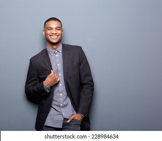 Portrait Of A Fashionable African American Man Smiling On Gray Background