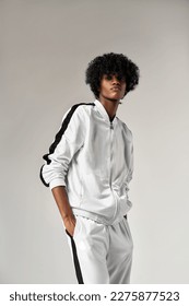 Portrait of fashionable black man in white tracksuit