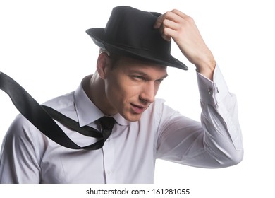 Portrait Of Fashionable Man Holding His Hat. Facing A Strong Wind, Isolated On White 