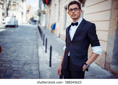 Portrait Of Fashionable Well Dressed Man Posing Outdoors Looking Away