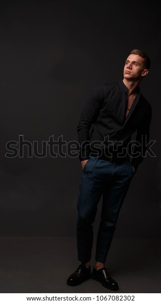 black shirt with dark blue pants