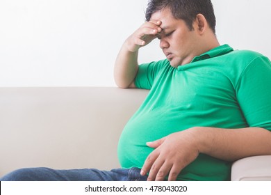 Portrait Of Fat Obese Man Thinking About His Weight Problem