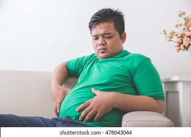 Portrait Of Fat Obese Man Thinking About His Weight Problem