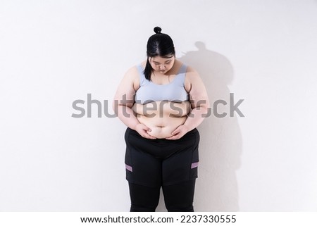 Portrait of fat woman in sportswear