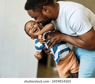 Portrait of father and son having fun at home in bedroom, family life, parenting, love and bonding concepts - Powered by Shutterstock