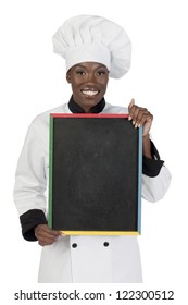 Portrait Of A Female African Chef Holding An Empty Black Board