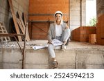 A portrait of a female architect leads the construction site, overseeing progress and ensuring attention to detail for the realization of the architectural vision.	
