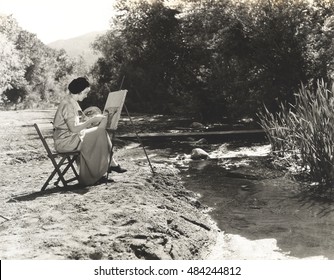 Portrait Of A Female Artist Painting By The River