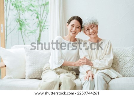 portrait of female asian family relaxing in a living room