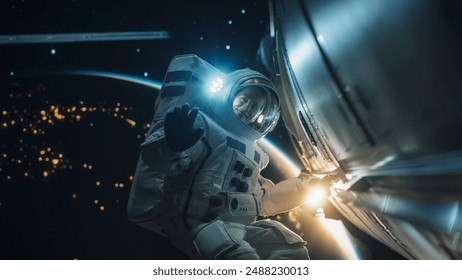 Portrait of a Female Astronaut Posing in a Space Suit During a Spacewalk Mission on a Spaceship, Satellite or a Space Station. Adult Woman Looking at Camera, Smiling and Waving Hello Gesture with Hand - Powered by Shutterstock