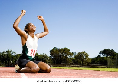 Portrait of a female athlete celebrating her win - Powered by Shutterstock