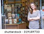 Portrait Of Female Bookshop Owner Outside Store
