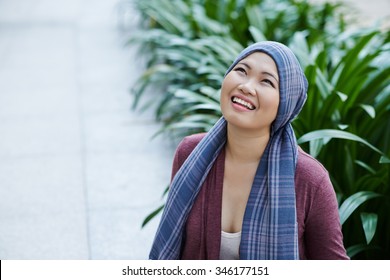 Portrait of female cancer survivor in headscarf - Shutterstock ID 346177151