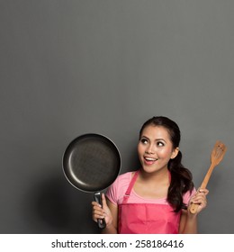 portrait of female chef or house wife ready to cook