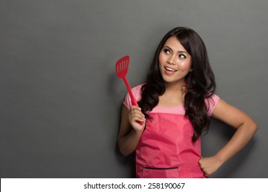 portrait of female chef or house wife ready to cook