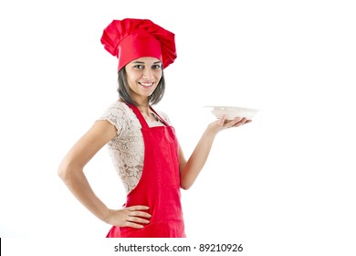 Portrait Of Female In Chef Uniform And Chef Hat Showing Plate
