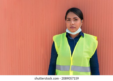 Portrait Of A Female Construction Worker Wearing A Protective Mask