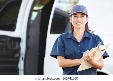 Portrait Of Female Delivery Driver With Clipboard