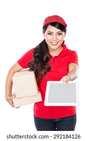 Portrait Of Female Delivery Service Happily Delivering Package To Costumer. Require Digital Signature