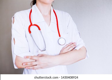 Portrait of female doctor with arms crossed in medical office - Shutterstock ID 1430408924