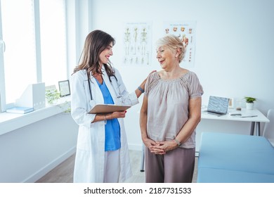 Portrait Of Female Doctor Explaining Diagnosis To Her Patient. Female Doctor Meeting With Patient In Exam Room. Cropped Shot Of A Medical Practitioner Reassuring A Patient