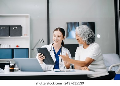 Portrait of female doctor explaining diagnosis to her patient. Doctor Meeting With Patient In Exam Room. A medical practitioner reassuring a patient in hospital
 - Powered by Shutterstock