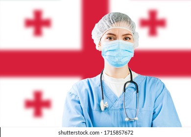 Portrait of female doctor or nurse with flag of Georgia in background,COVID-19 virus disease crisis,new Coronavirus variant global worldwide pandemic,social distancing isolation and quarantine concept
