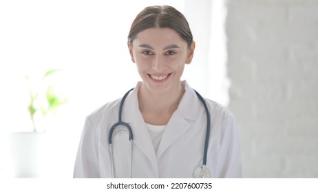 Portrait Of Female Doctor Showing Yes Sign By Head Shake