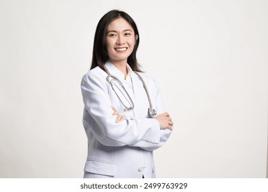 Portrait female doctor wearing medical uniform and stethoscope at hospital.Beautiful smiling young asian woman doctor isolated on white background.Doctor arms crossed wear white coat and stethoscope. - Powered by Shutterstock