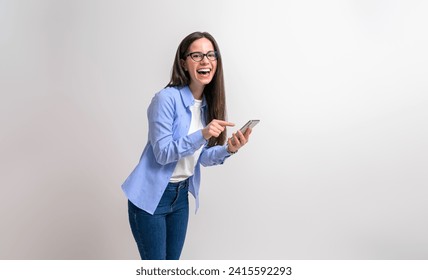 Portrait of female entrepreneur laughing and texting over smart phone on isolated white background - Powered by Shutterstock