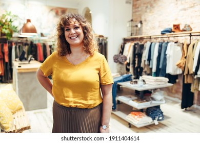 Portrait Of Female Fashion Store Owner. Woman Standing In Fashion Shop And Smiling.