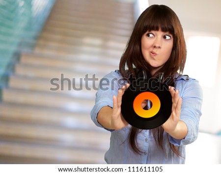 Portrait Of A Female Holding A Disc, Indoor