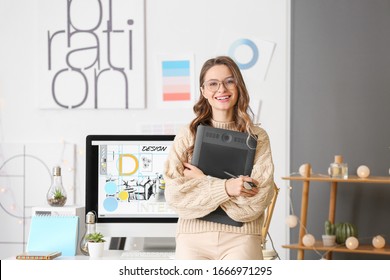 Portrait of female interior designer in office