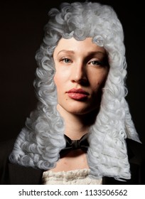 Portrait Of Female Lawyer On Black Background