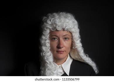 Portrait Of Female Lawyer On Black Background